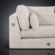 Close-up of a light brown polyester sectional sofa with plush cushions and silver connecting hardware.