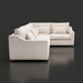 Light beige left arm facing sectional sofa with five pillows and a brown stained poplar base.