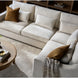 Surya Pedersen Left Arm Facing Sectional in light brown polyester with accent pillows and a wooden coffee table.