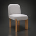 Surya Pico Dining Chair with taupe polyester-linen upholstery and brown rubber wood legs.