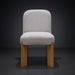 Surya Pico Dining Chair with taupe polyester-linen upholstery and brown rubber wood base.