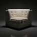 Compact cream modular sofa with tufted back and seat, ideal for accent seating.