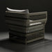 Surya Winder accent chair with cream Sunbrella cushions and a woven, powder-coated aluminum frame.