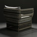 Surya Winder accent chair with cream Sunbrella cushions and a woven, powder-coated aluminum frame.