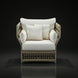 Surya Winder accent chair with cream Sunbrella cushions and a woven beige frame.