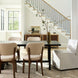 Surya Devin Dining Chairs with cream polyester upholstery and wheat beechwood bases around a black dining table.